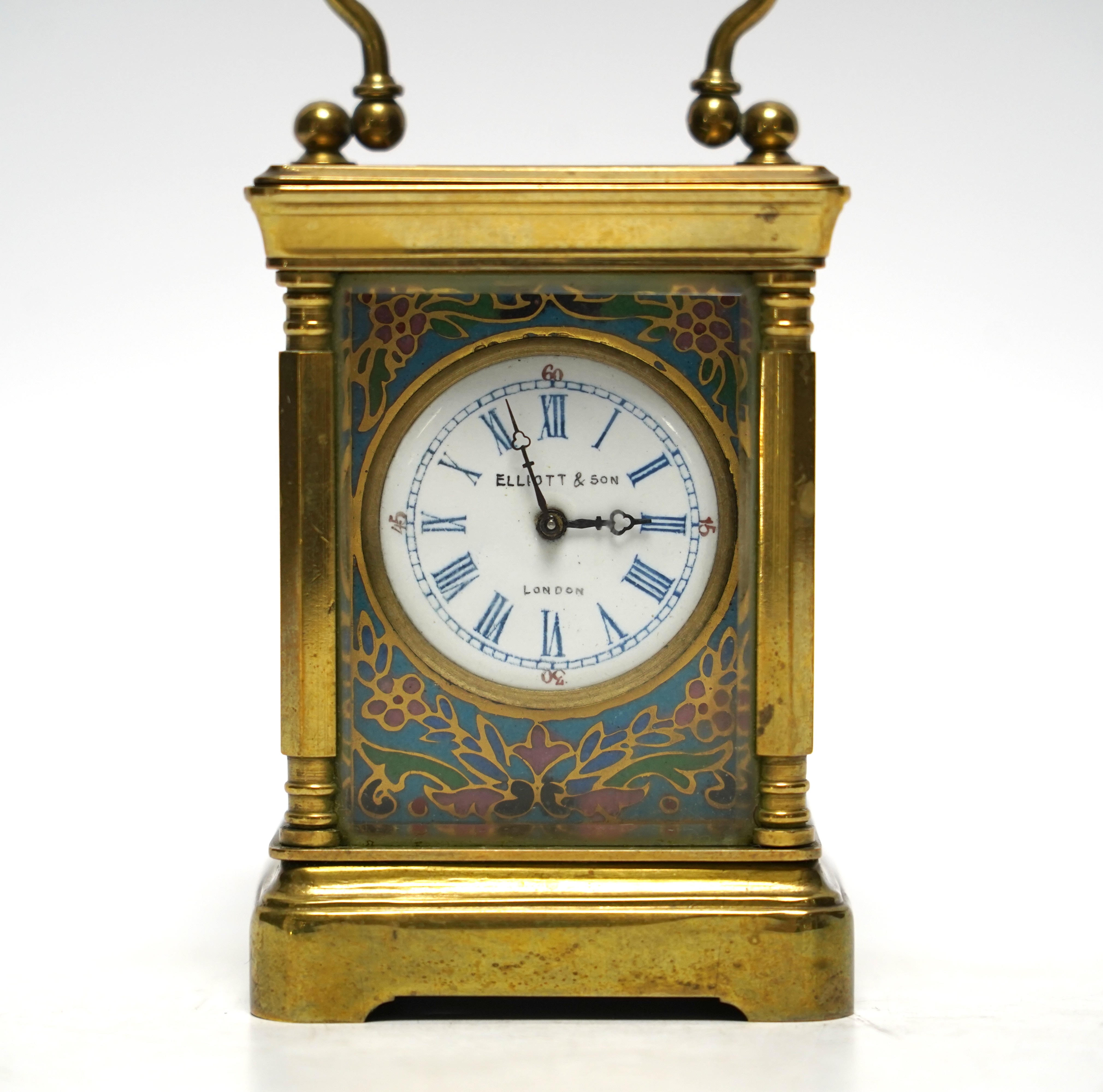 A miniature French brass carriage clock, with champlevé enamel panels, face signed Elliott & Son, London, 8.5cm
